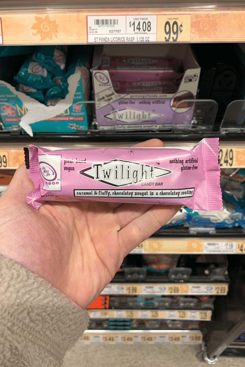 A hand holding a Twilight vegan candy bar