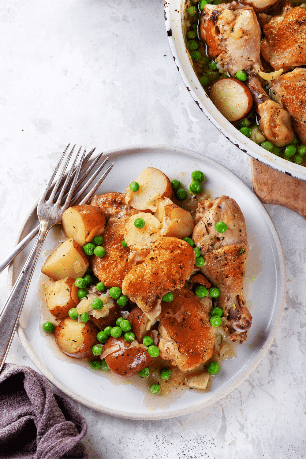 A plate filled with chicken Vesuvio.