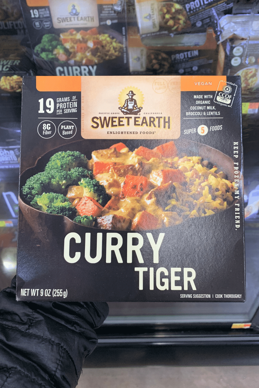 A hand holding sweet earth Curry Tiger.