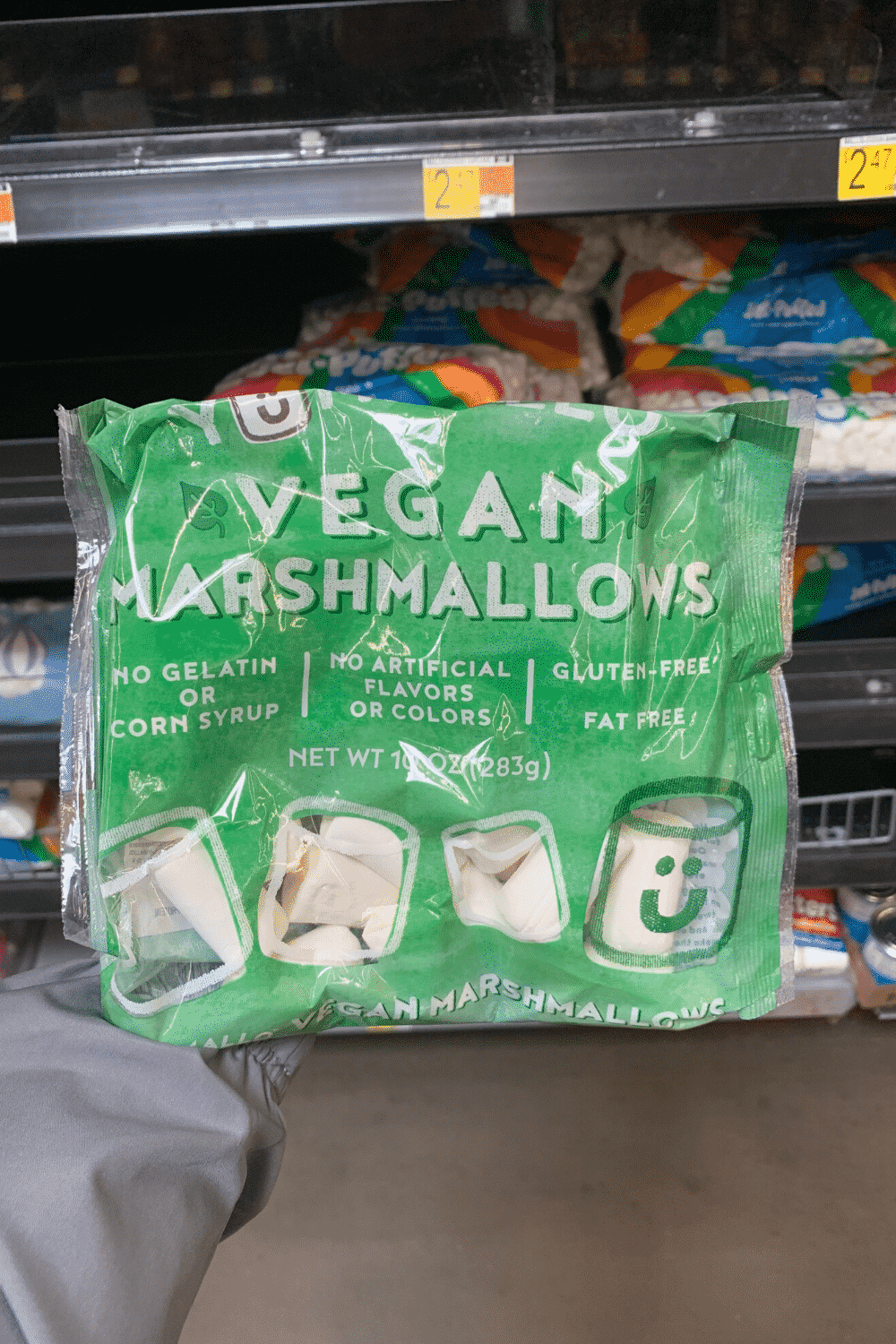 A hand holding Yummalo vegan marshmallows.