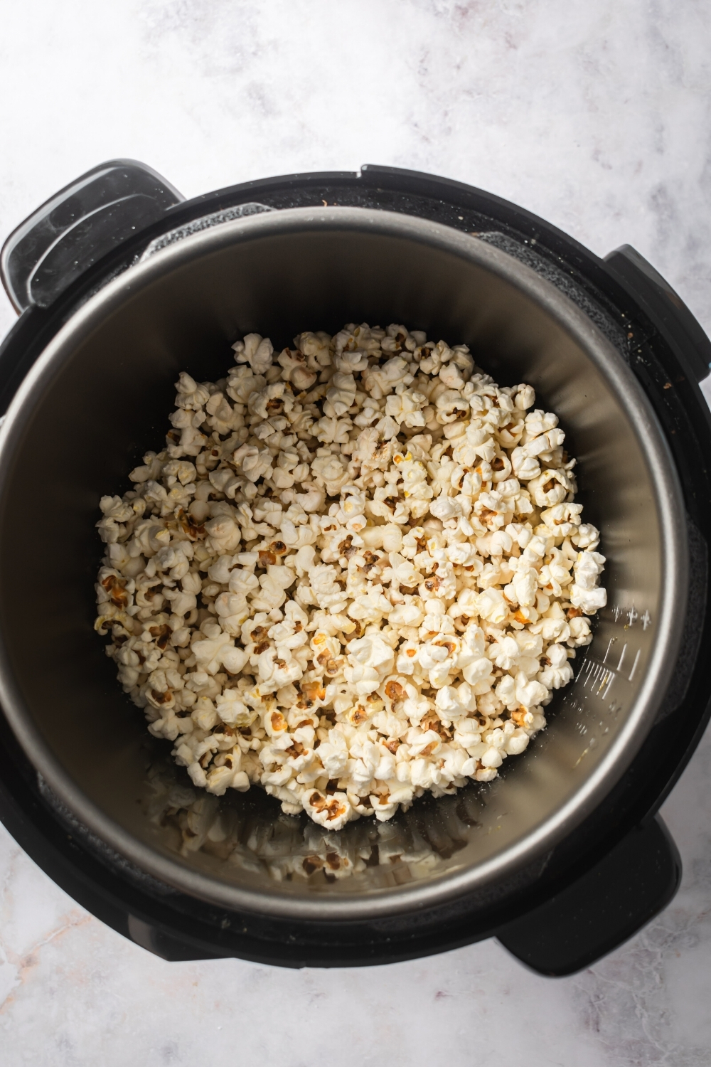 An instant pot filled with popcorn.