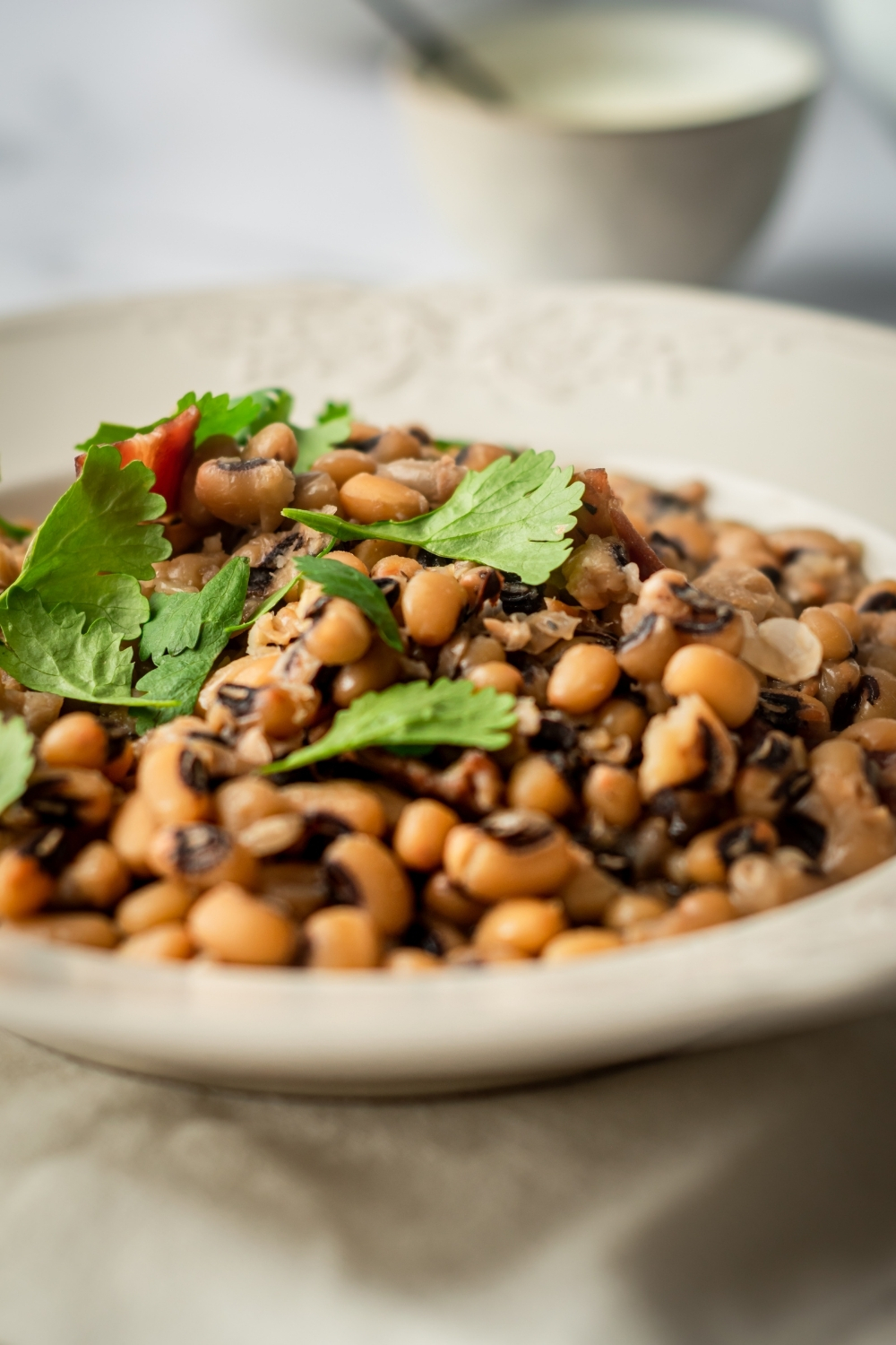 Black-eyed peas in a white bowl.