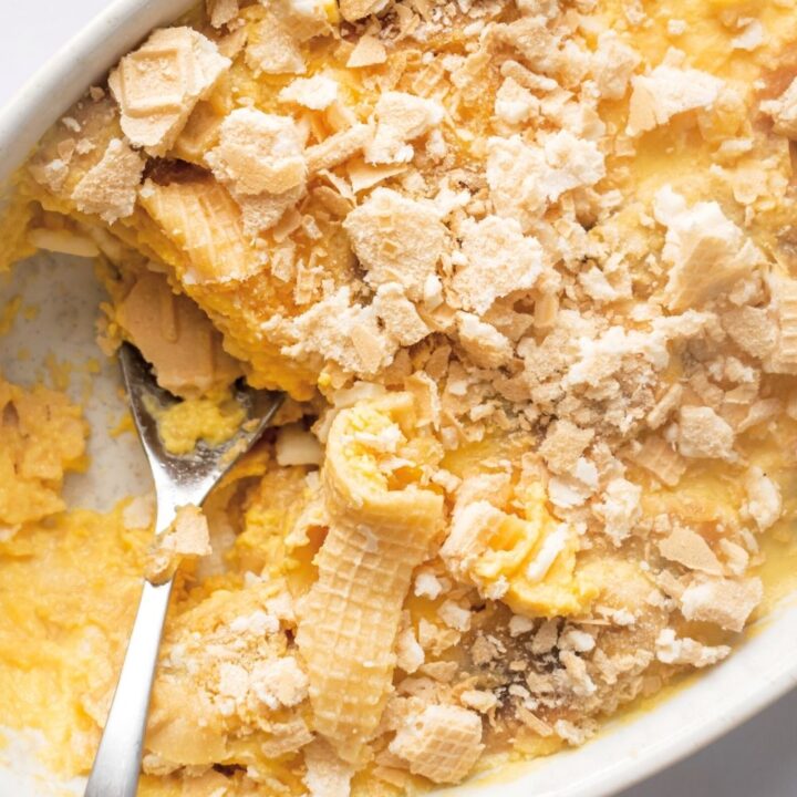 Banana pudding in part of a white casserole dish.