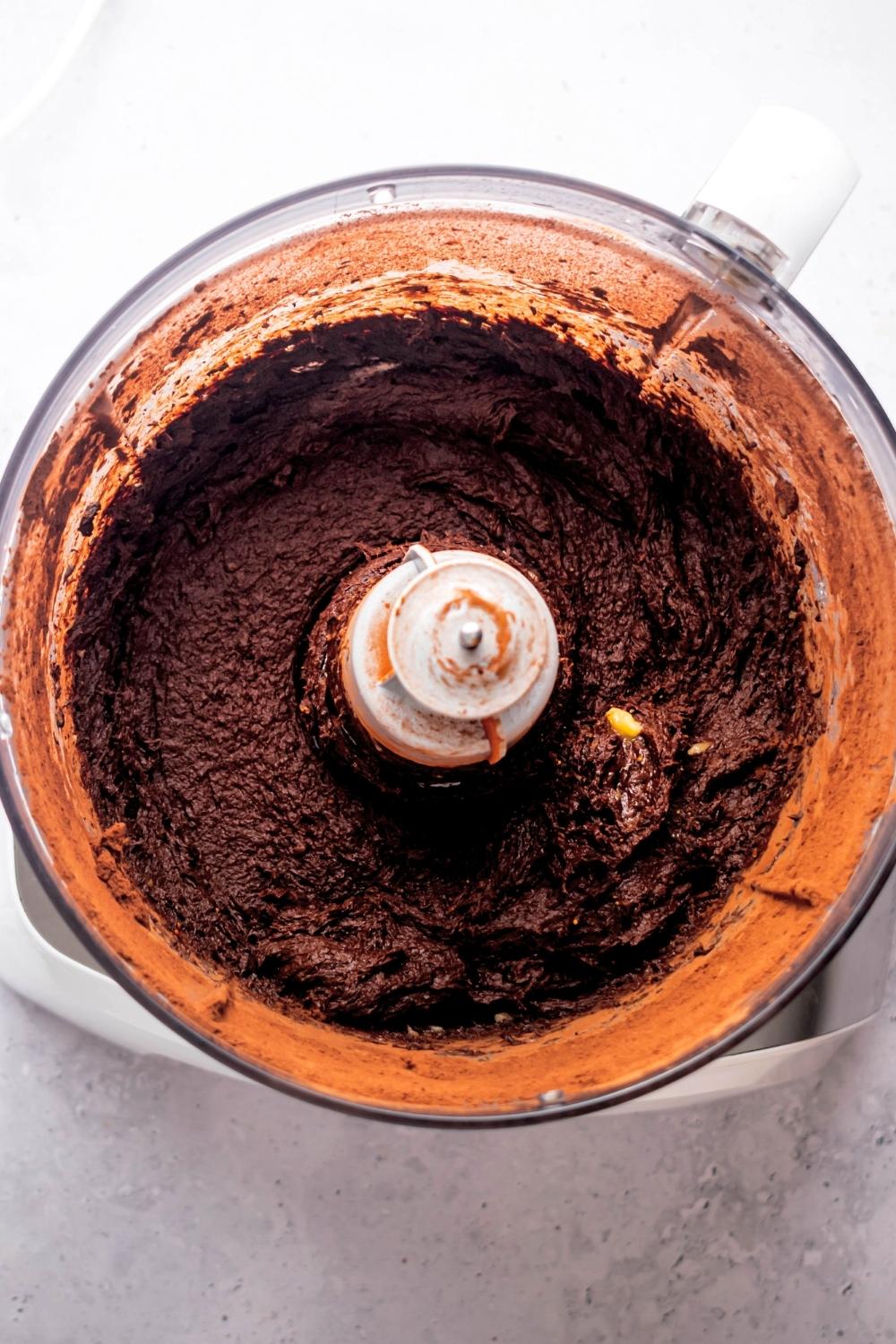 Three ingredient brownie batter in a food processor.