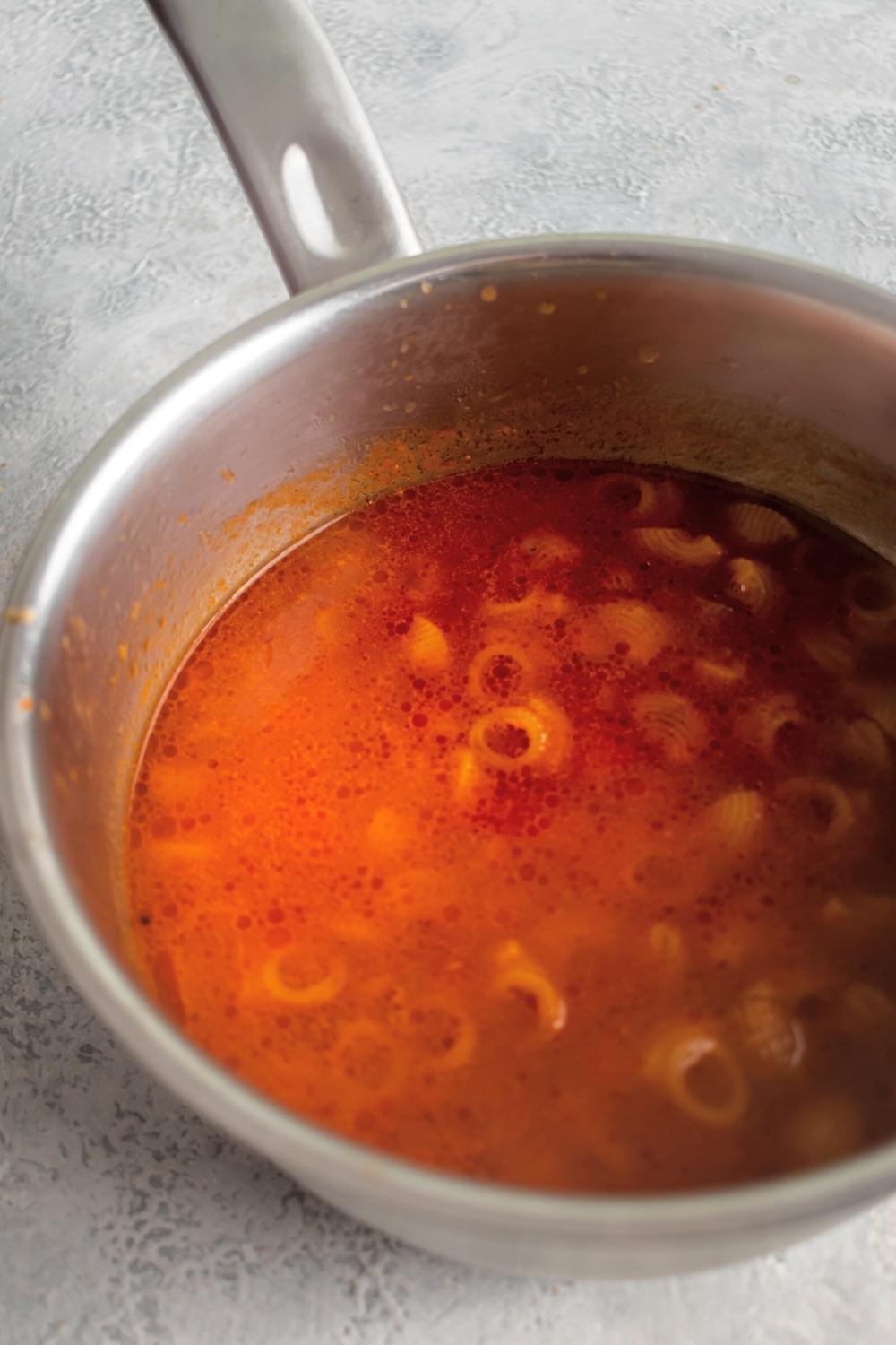 Part of a pot filled with sopa de conchas.