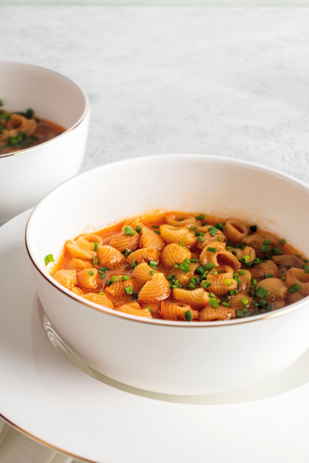 A white bowl with sopa de conchas in it.