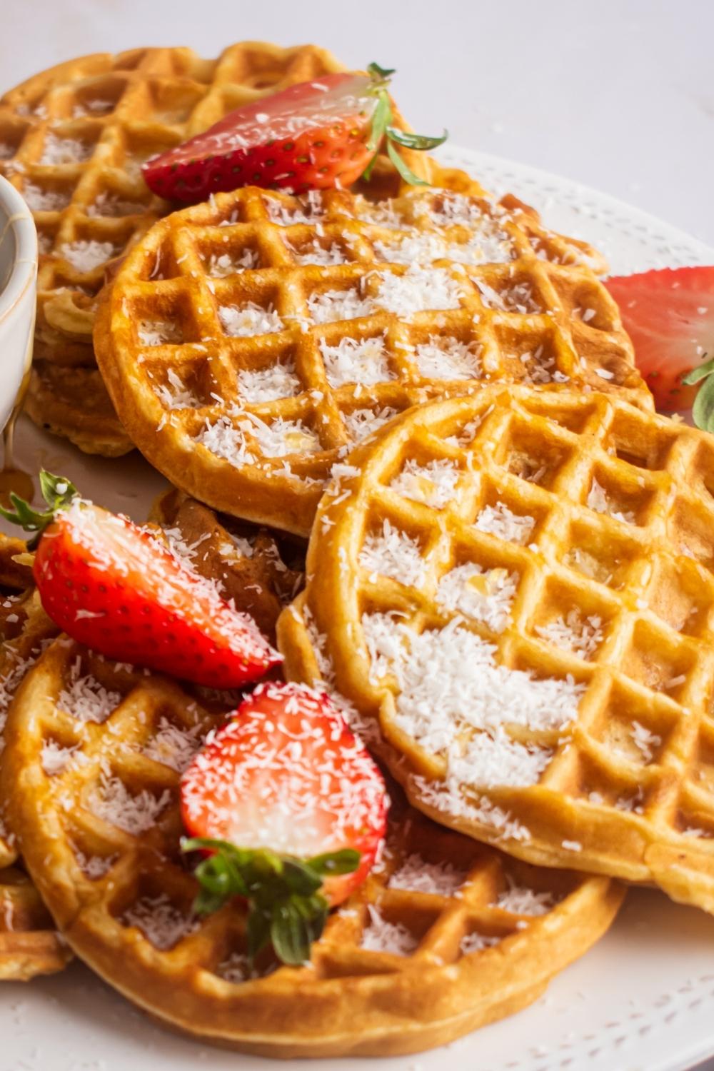 4 Aunt Jemima waffles overlapping one another on a white plate.