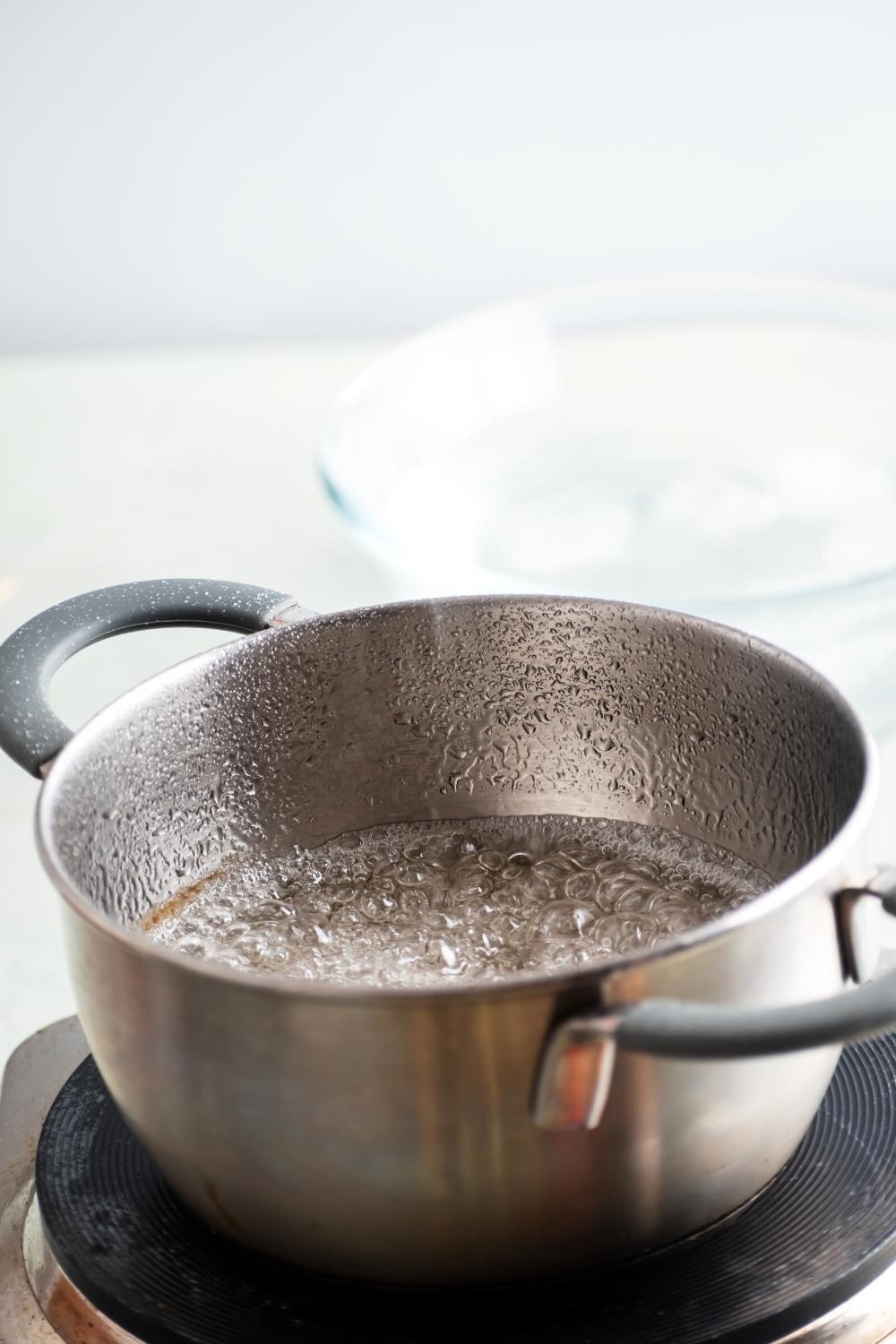 A pot of water and sugar.