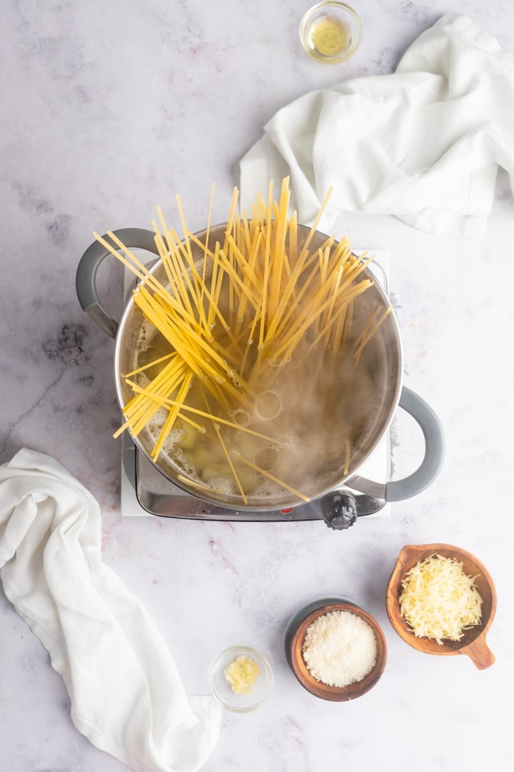 Pasta in a pot of boiling water.