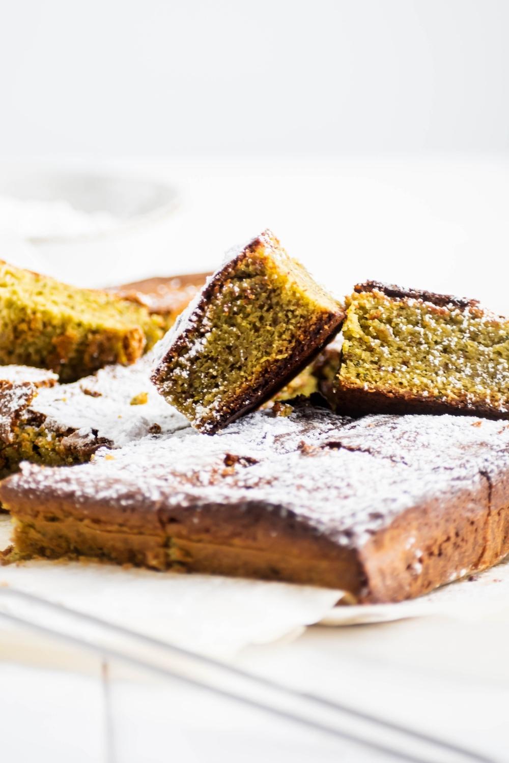 Matcha brownie squares on top of one another.