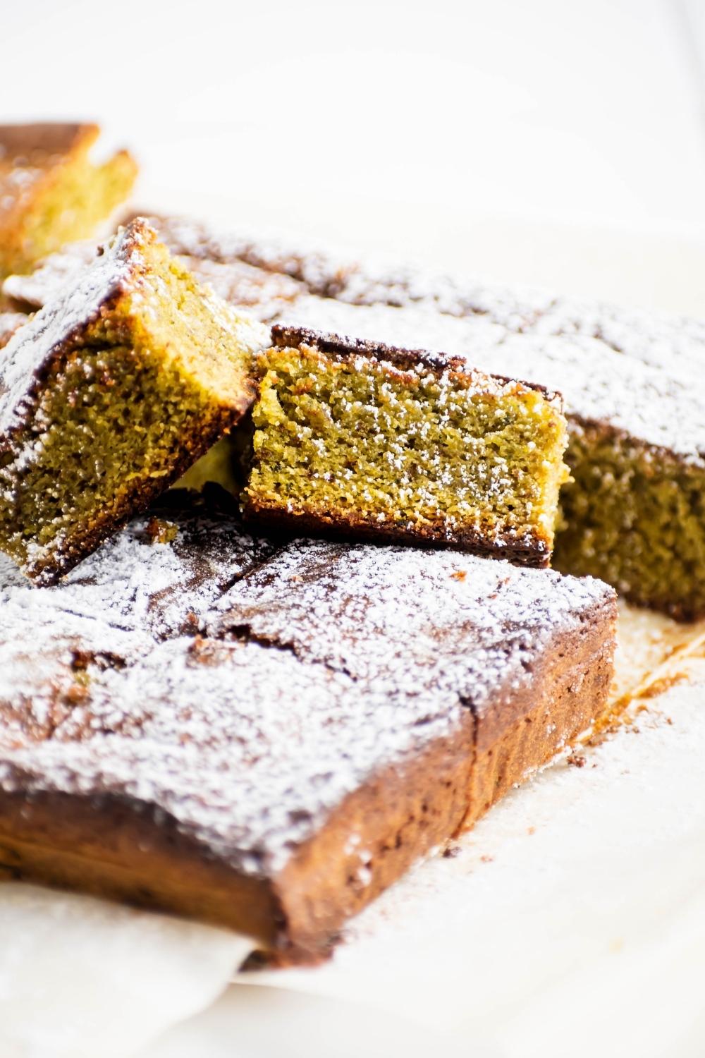 A few matcha brownie squares and more cut matcha brownies.