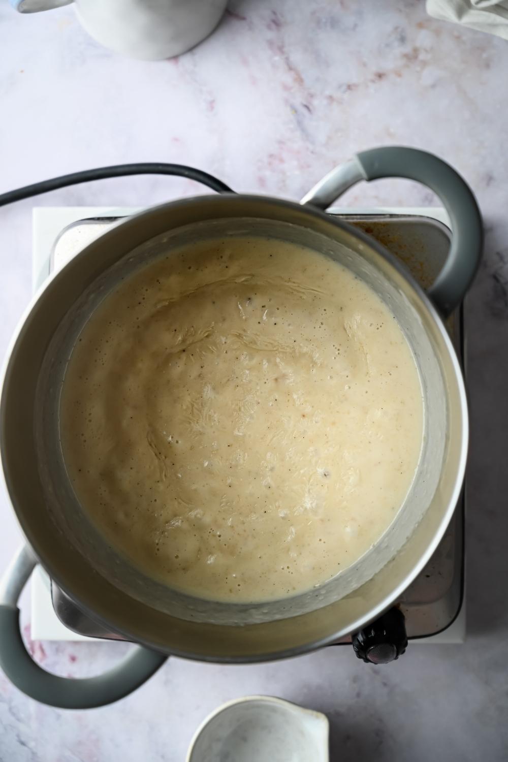 white gravy simmering in a pot