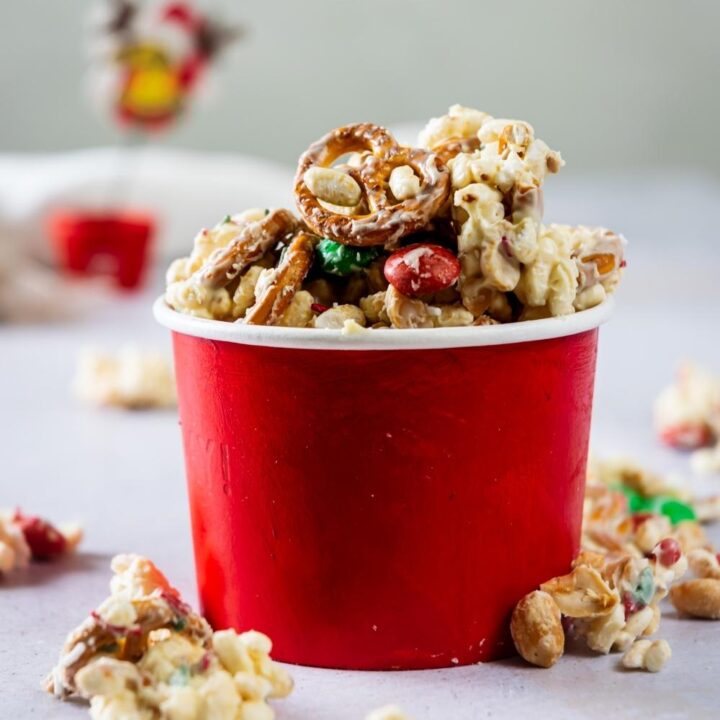 white trash mix in a red paper bowl
