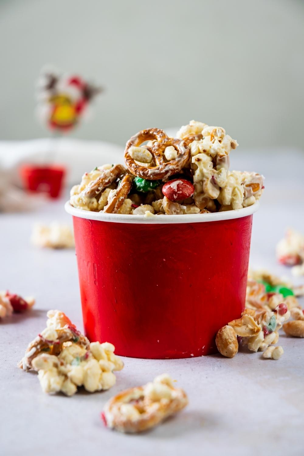 white trash mix in a red paper bowl