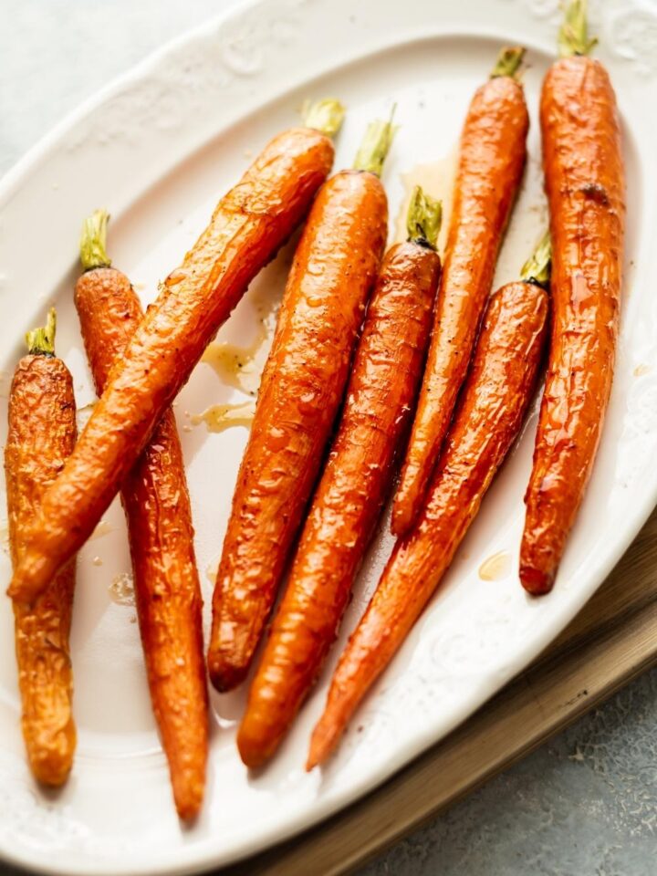 candied carrots on a white plate