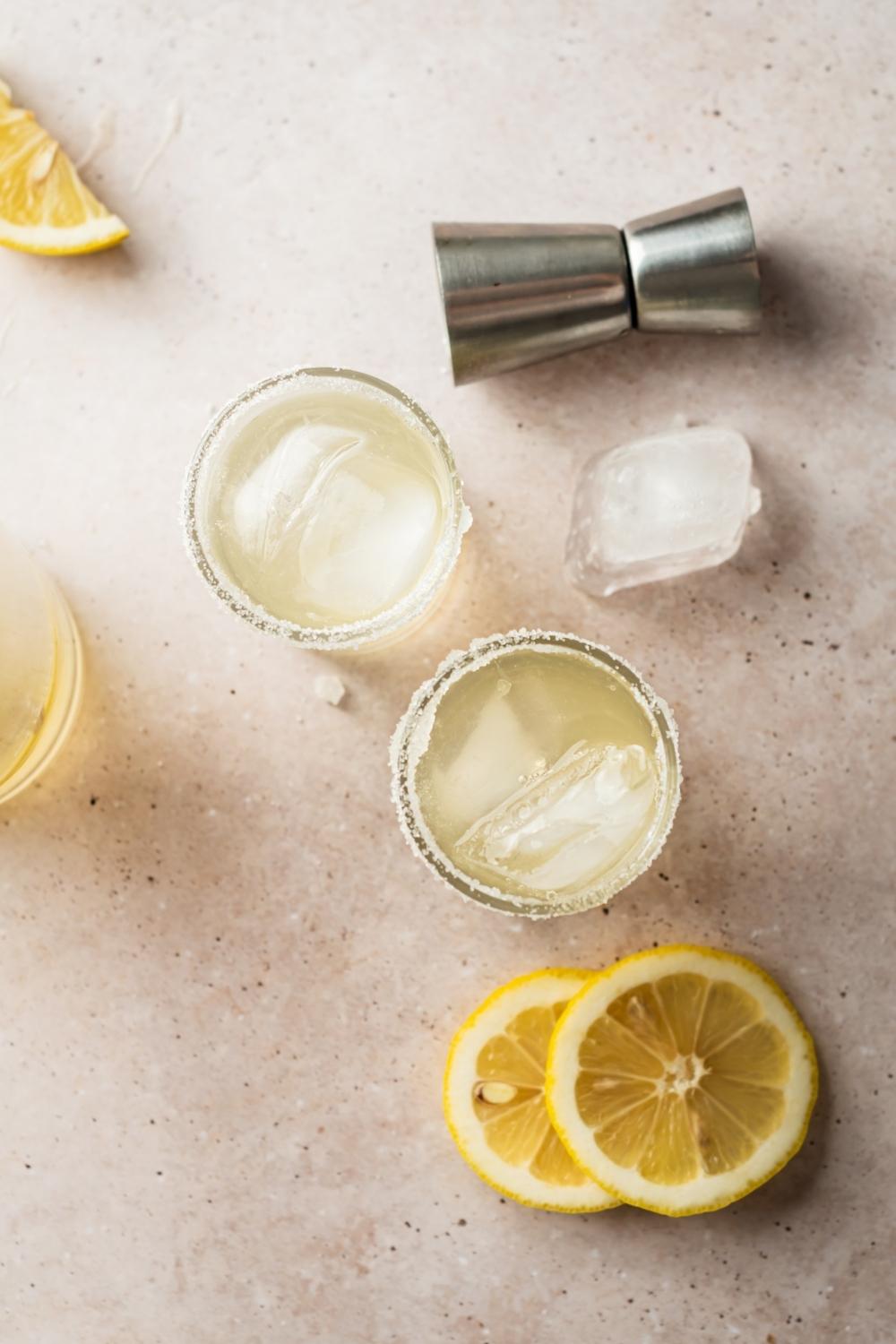 overhead shot of two lemon drop shots with sugar on the rim