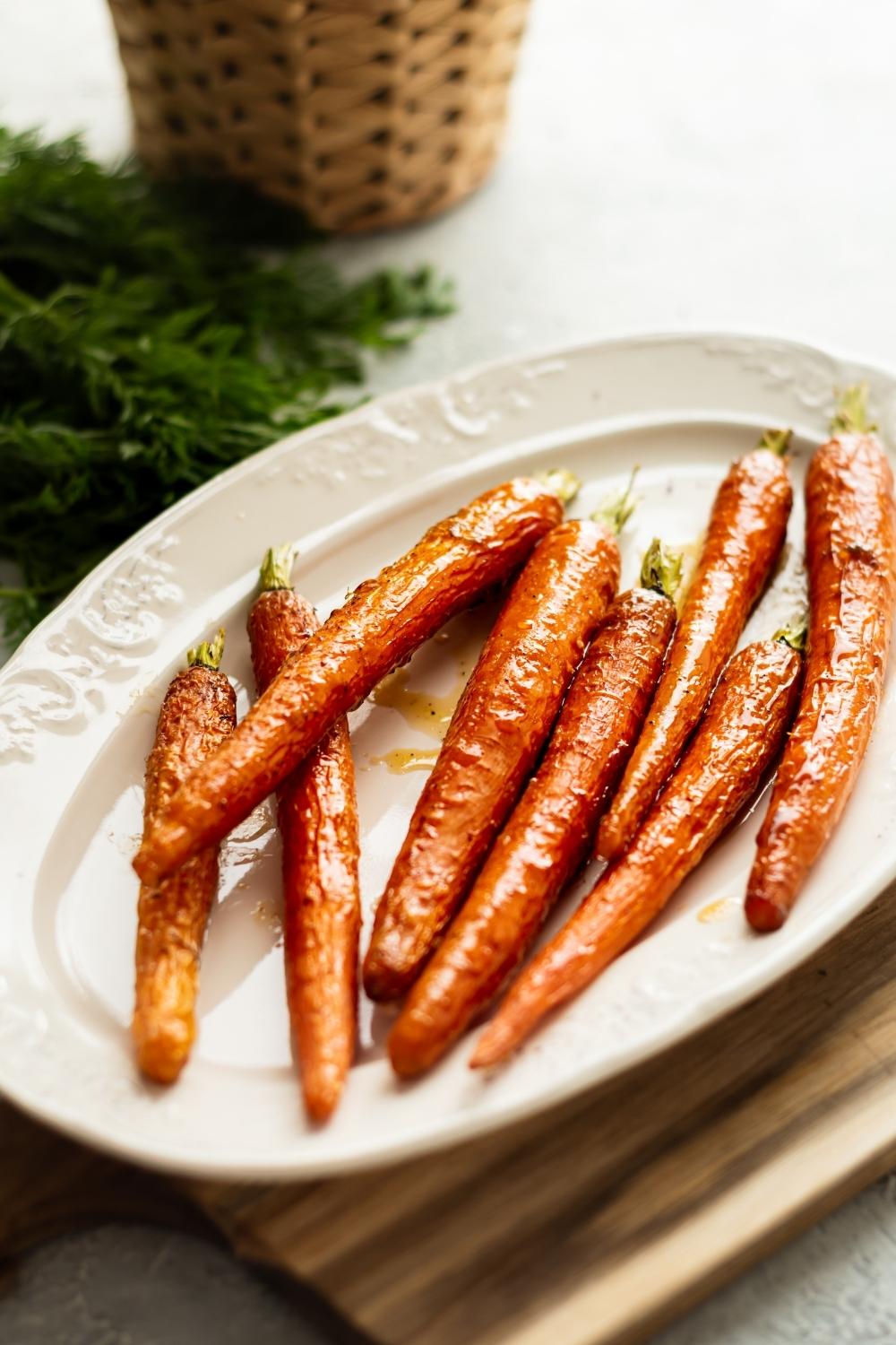 candied carrots on a white plate