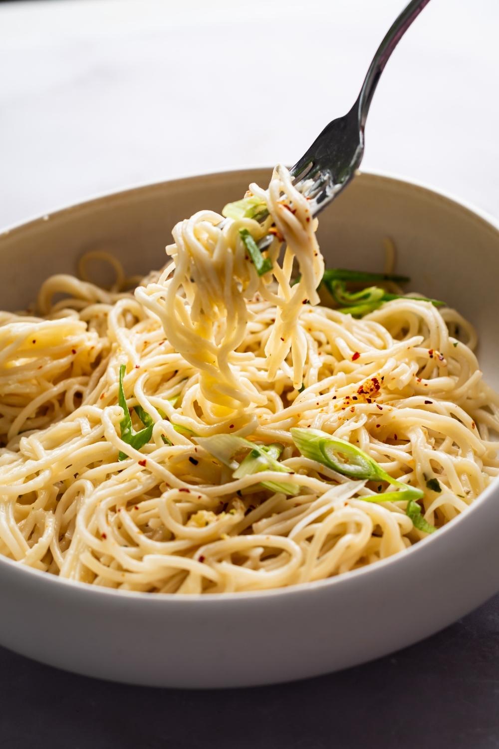 cheesy ramen twirled on a fork