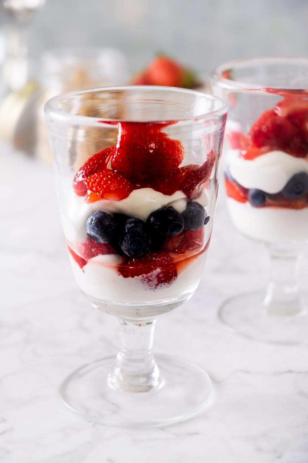 parfait glass layered with berries and yogurt