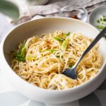cheesy ramen garnished with green onions