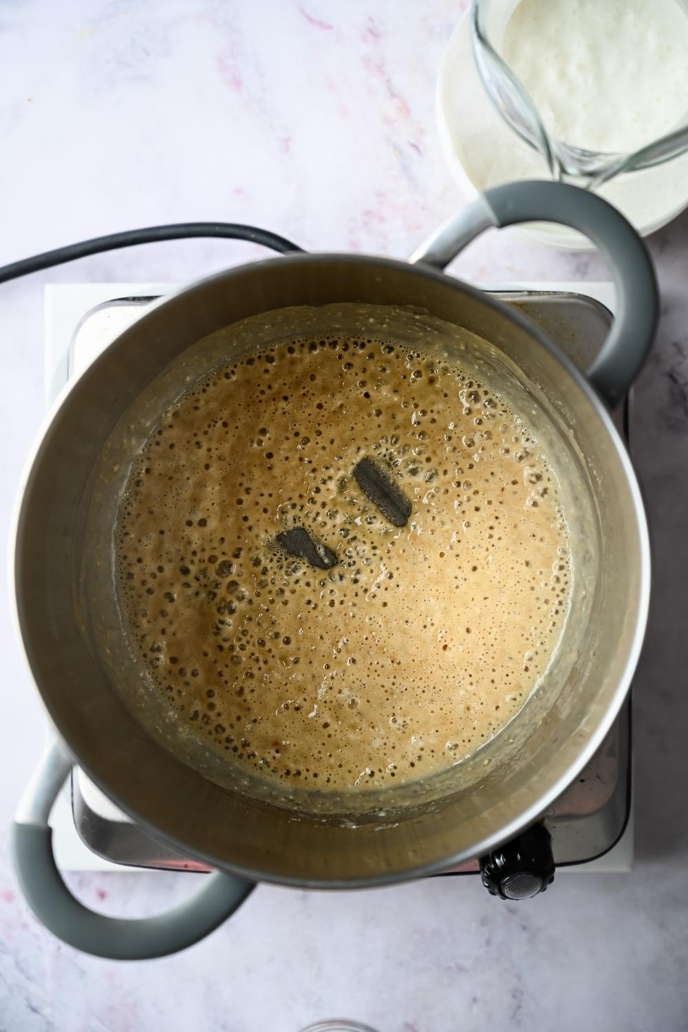 white gravy roux simmering in a pot