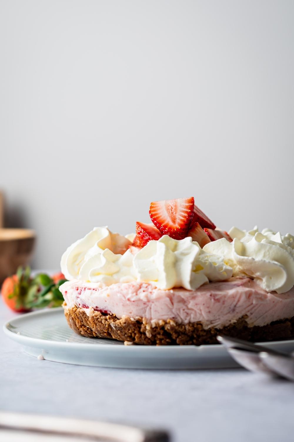 A no bake strawberry pie on a plate.
