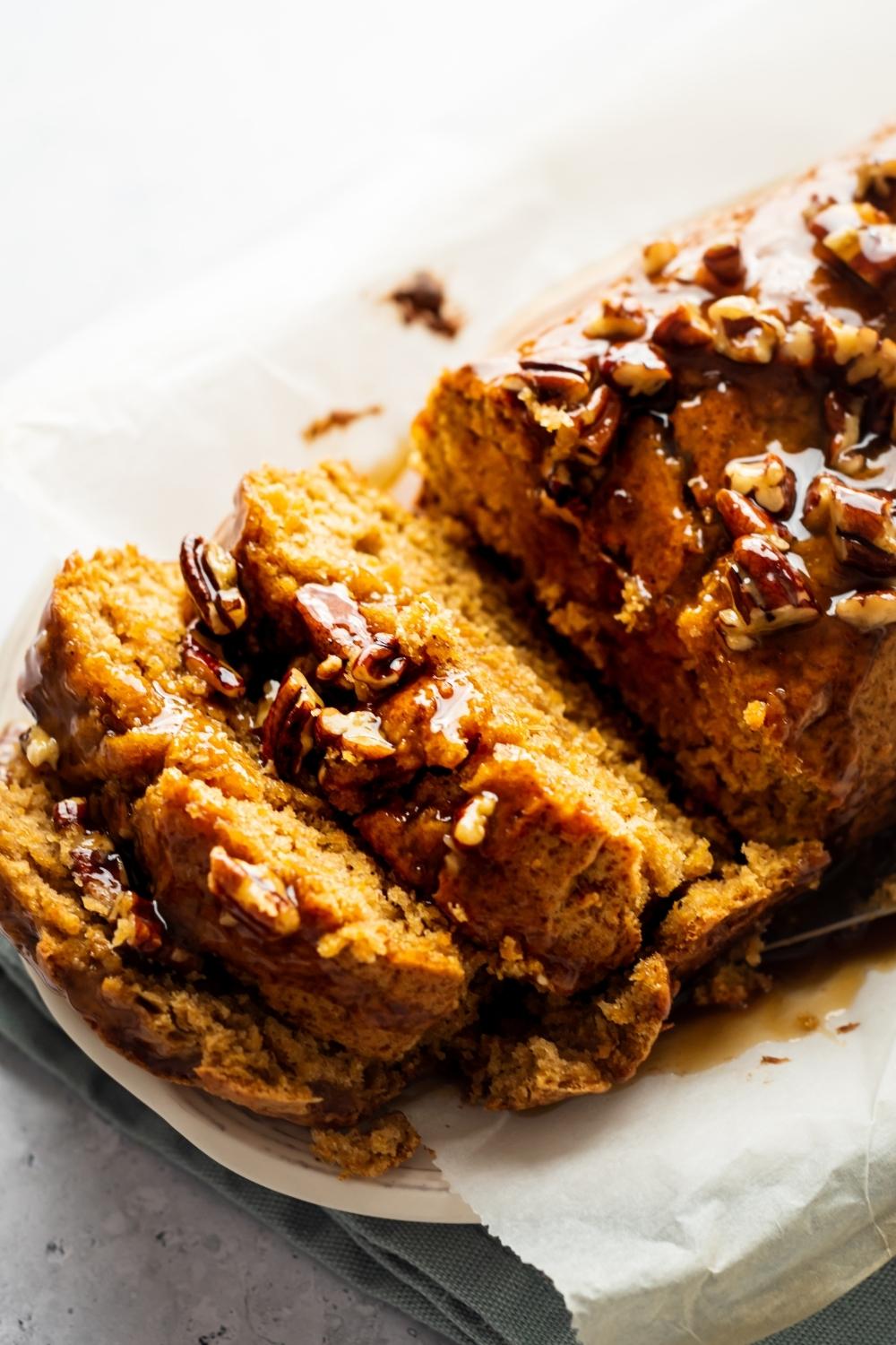 Three slices of sweet potato pancake in front of part of the poundcake.