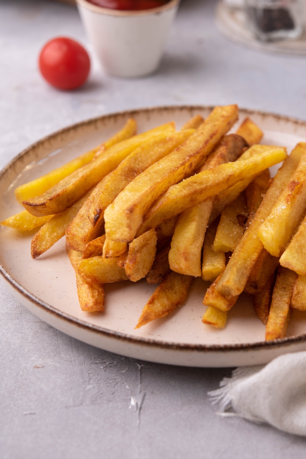 A plate with french fries.