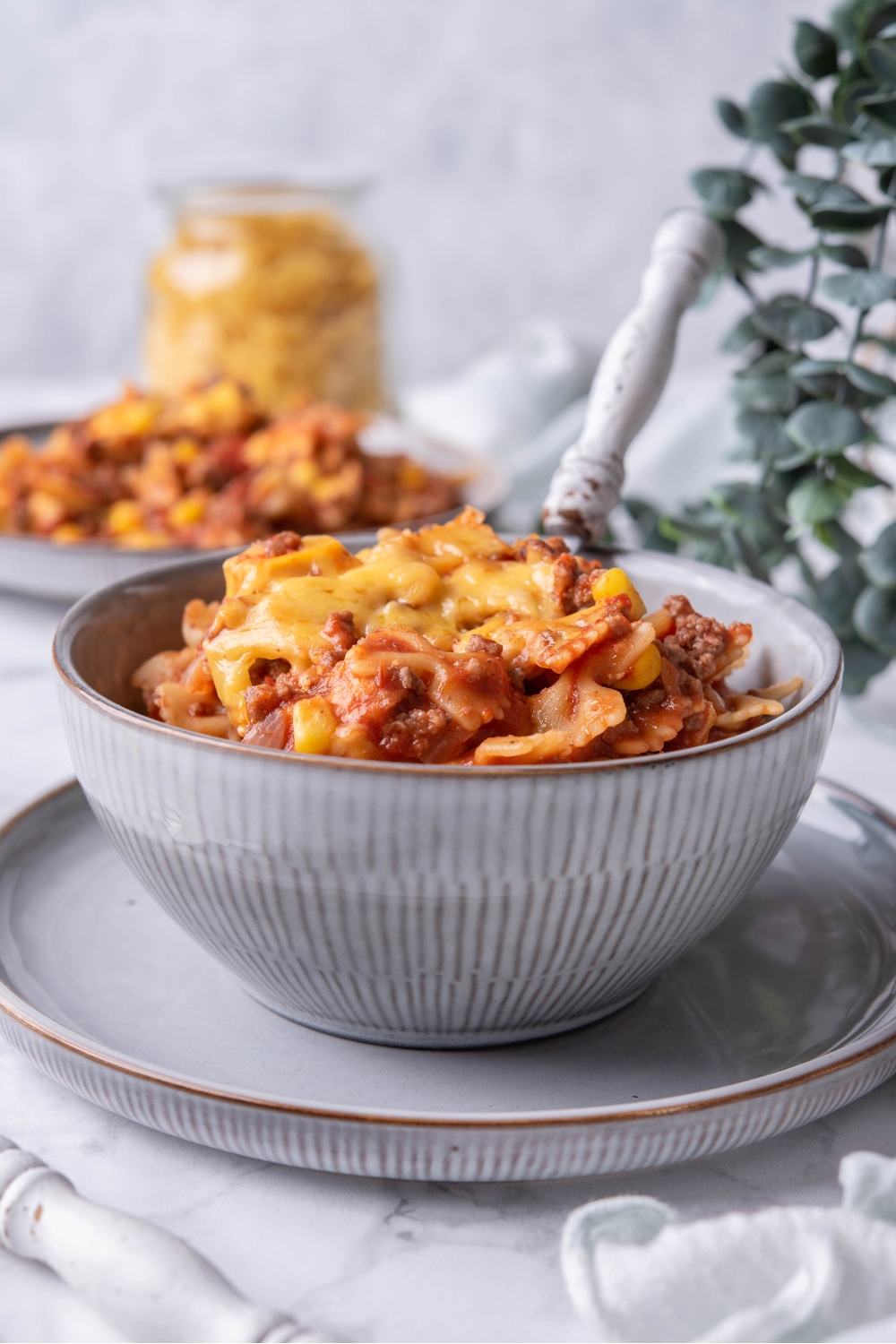A bowl filled all the way to the top with sloppy joe casserole.
