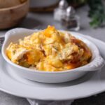 Chicken tater tot casserole and a white bowl.