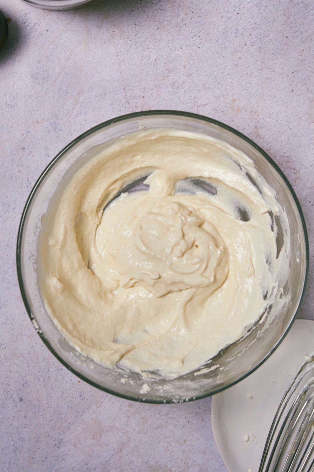 Creamy sour cream and flour mixture in a glass bowl.