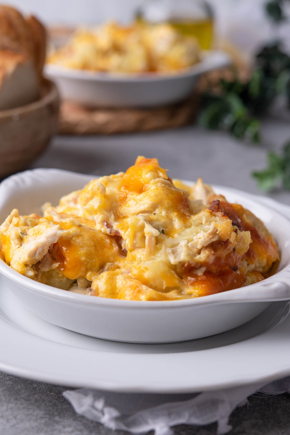 Chicken tater tot casserole in a white bowl.