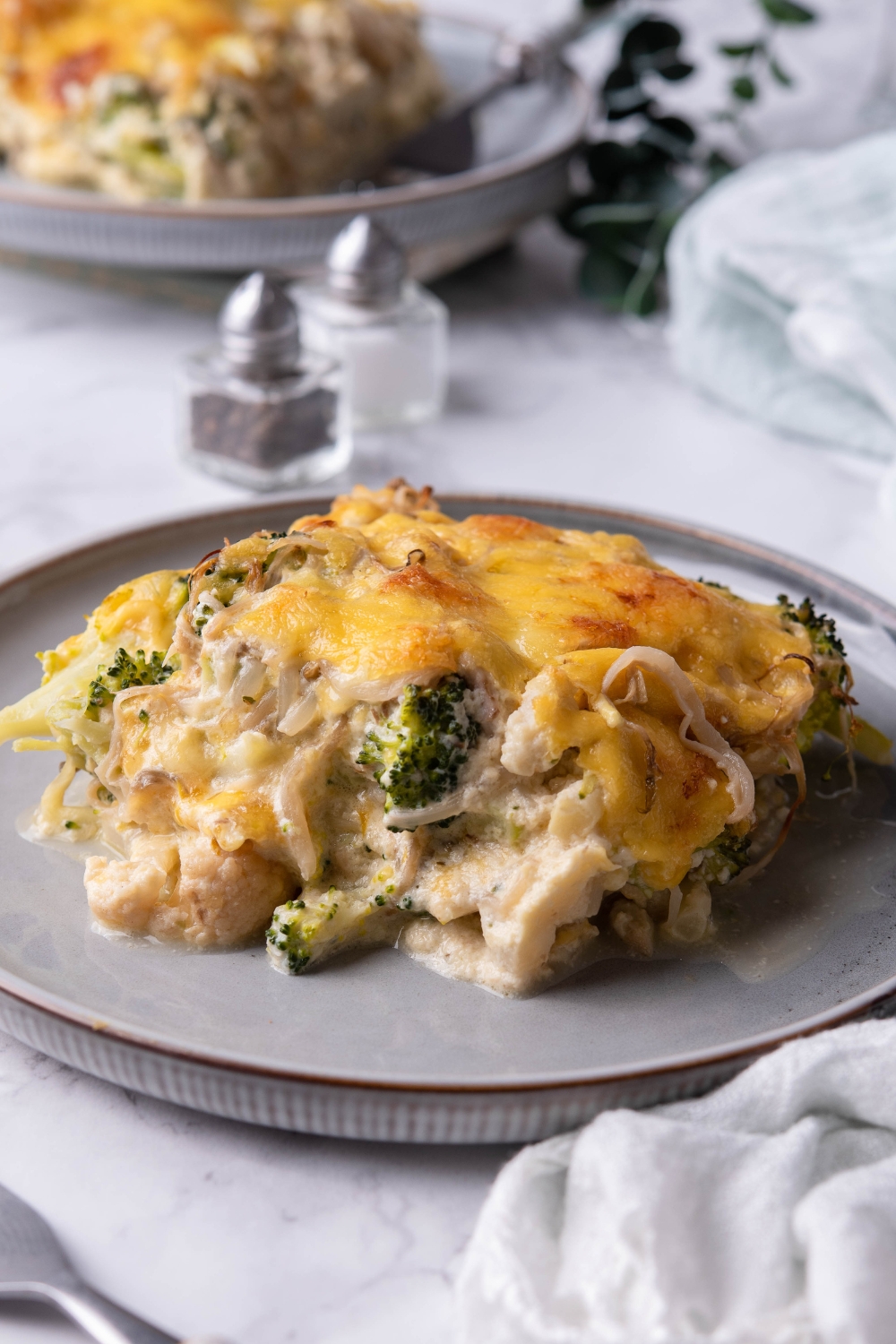 A big piece of vegetable casserole on top of a plate.