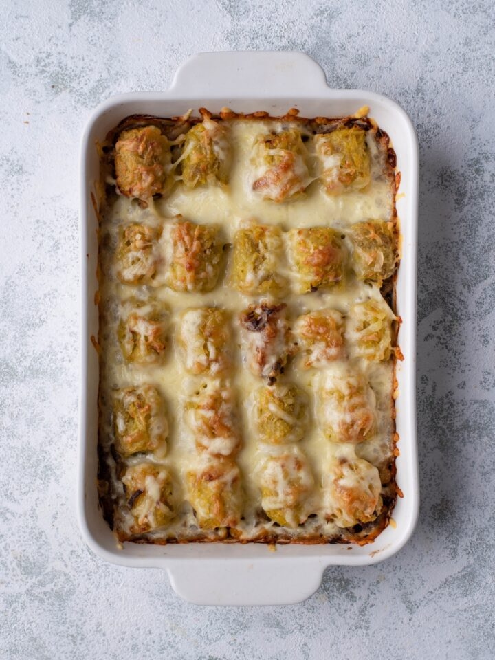 Cowboy casserole in a white baking dish.