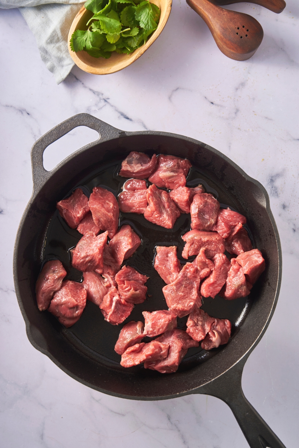Stew meat in a large pot.