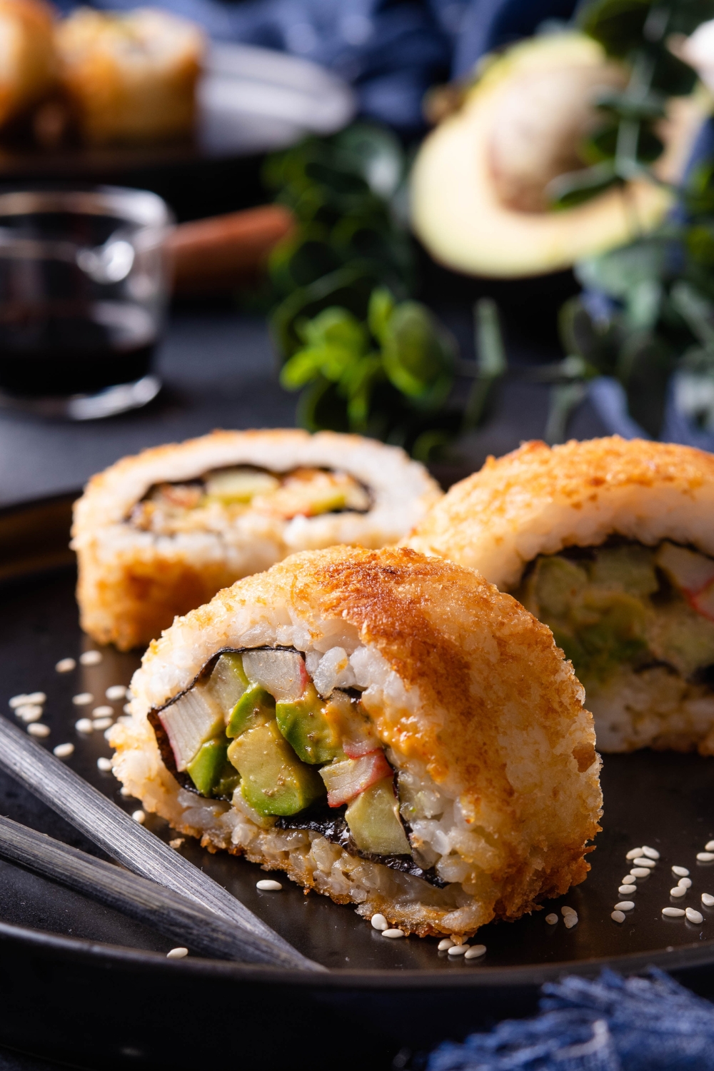A close-up of fried sushi on a plate.