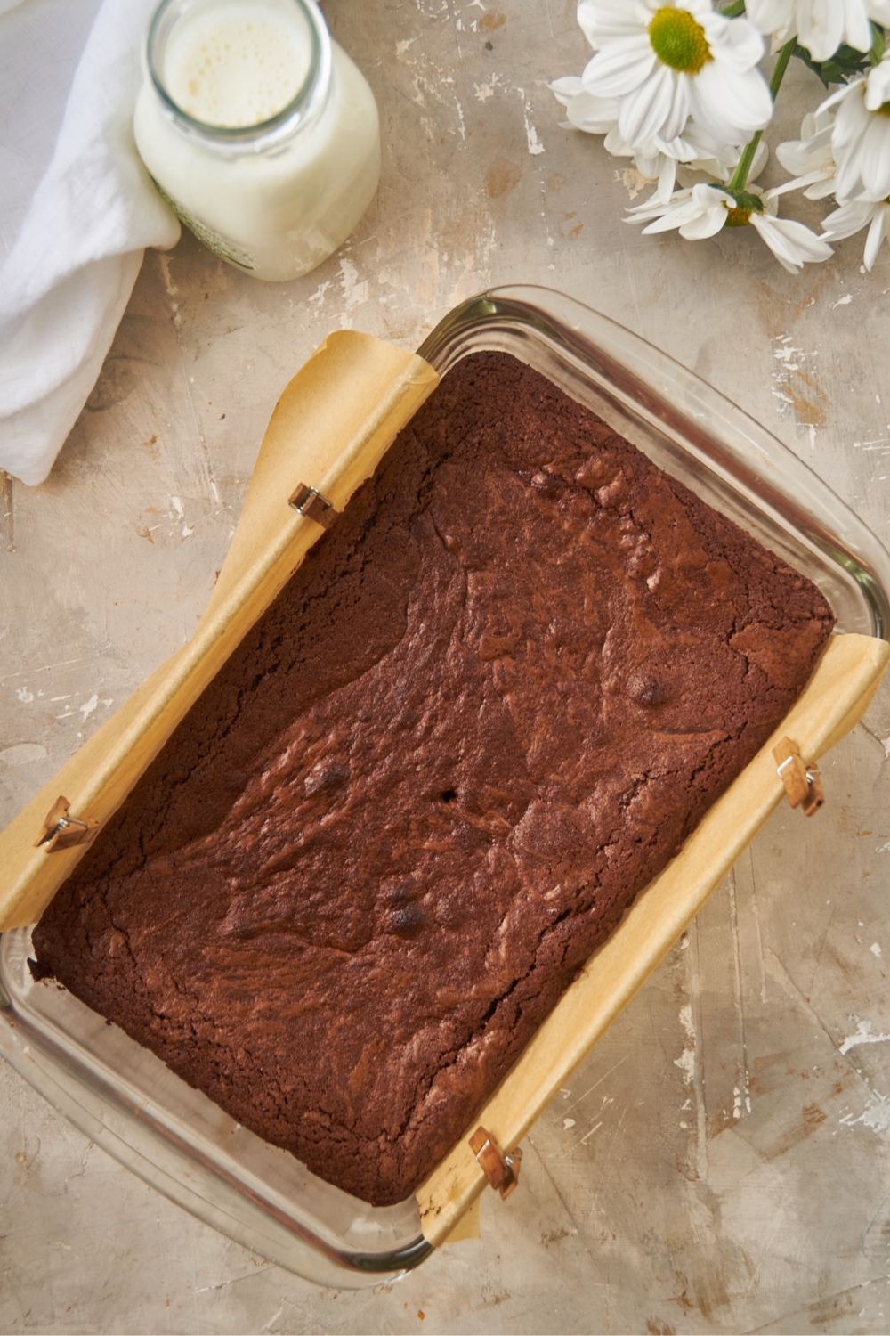 A pan with baked brownies in it.