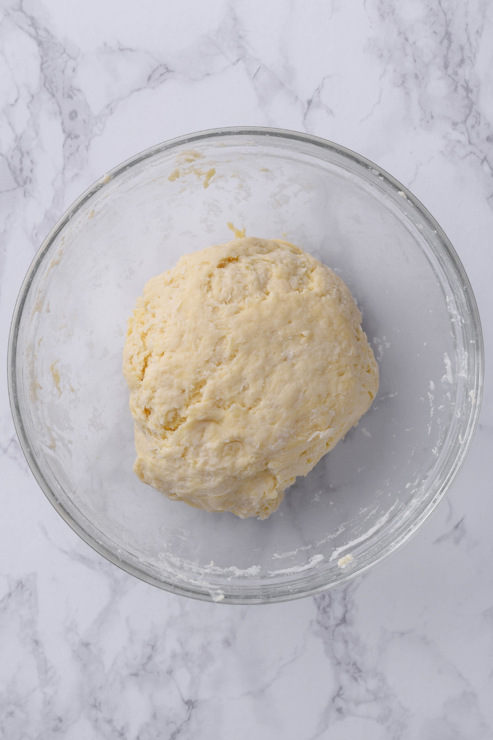 A mixing bowl with the biscuit dough.