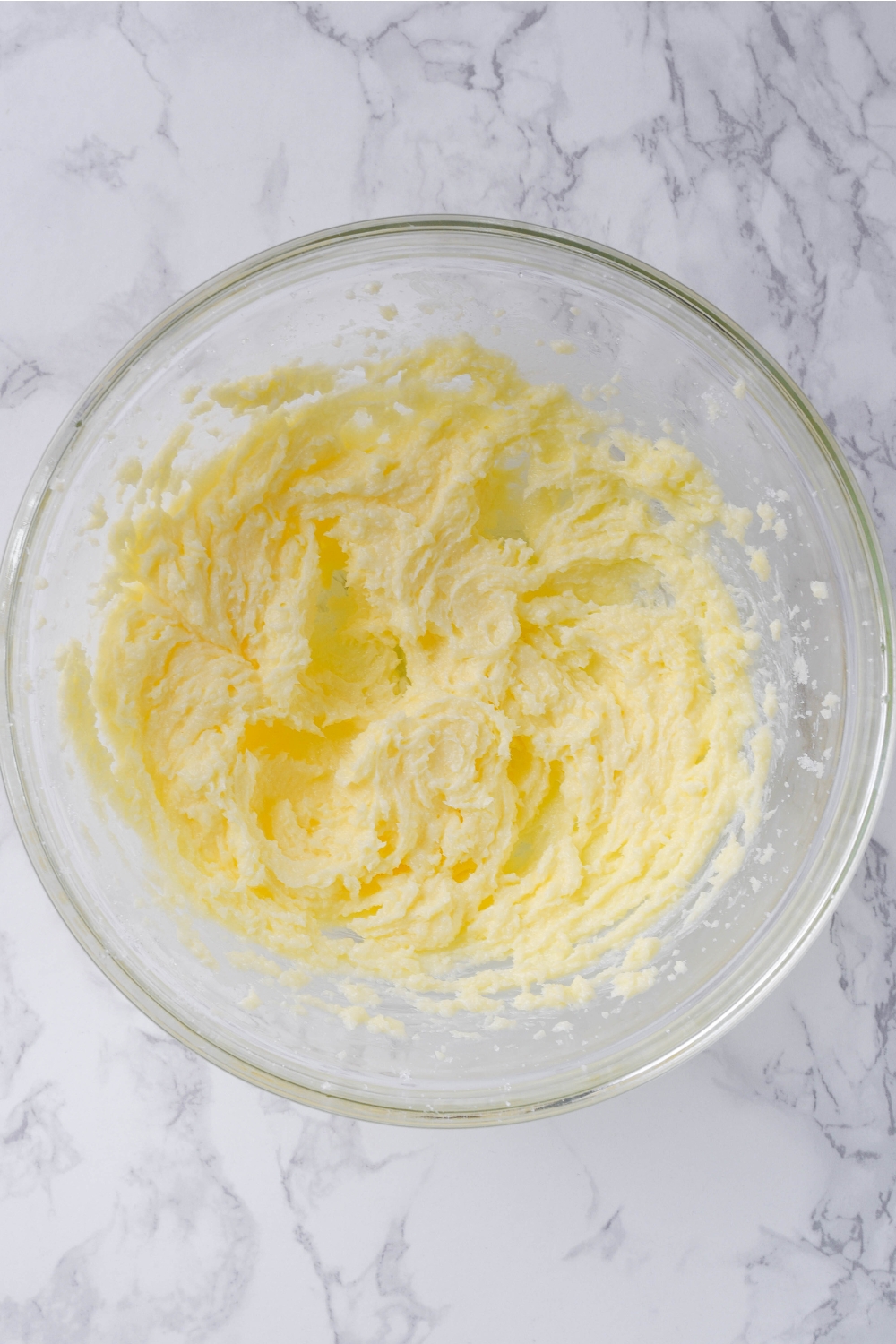 A mixing bowl with butter and sugar creamed.