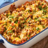 Taco potato casserole in a white casserole dish.