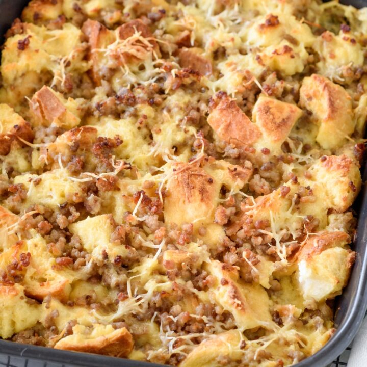 A baking dish filled with freshly baked breakfast casserole that's resting on a cooling rack.