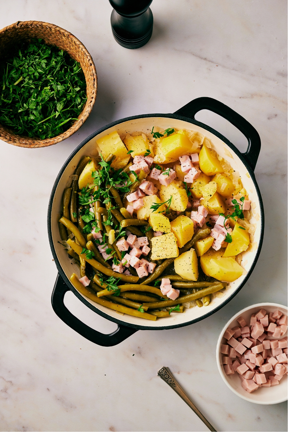 A pot with ham, green beans, and diced potatoes.