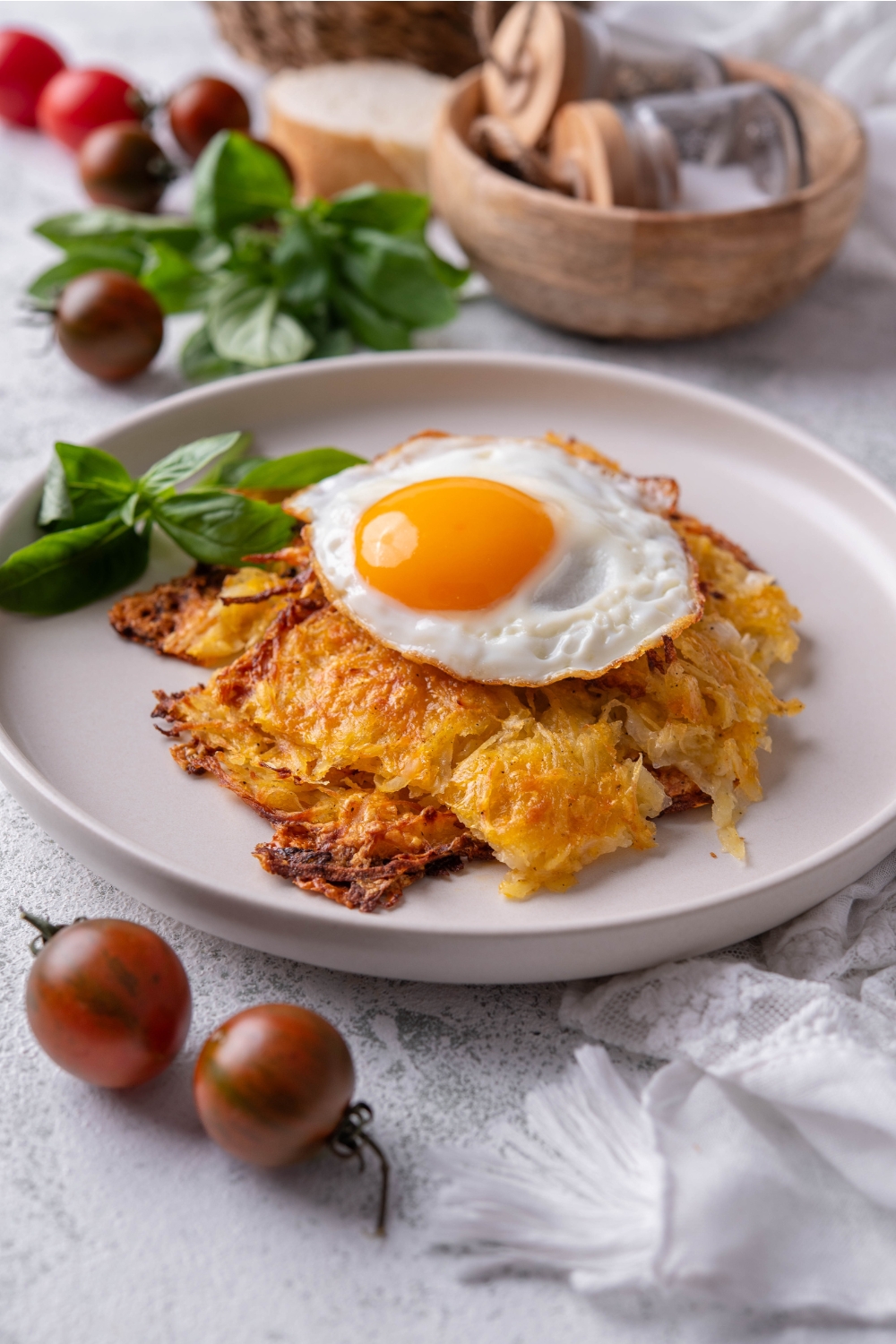 Plate with golden brown hash browns topped with a sunny side up egg.