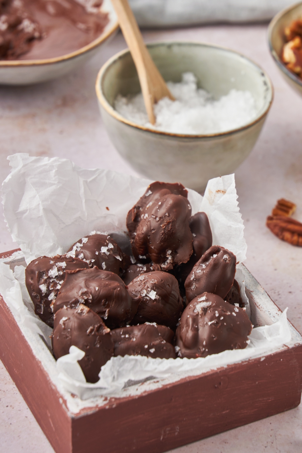 Chocolate covered pecans topped with salt.