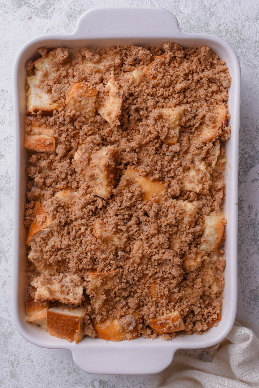 A casserole dish with unbaked french toast casserole.