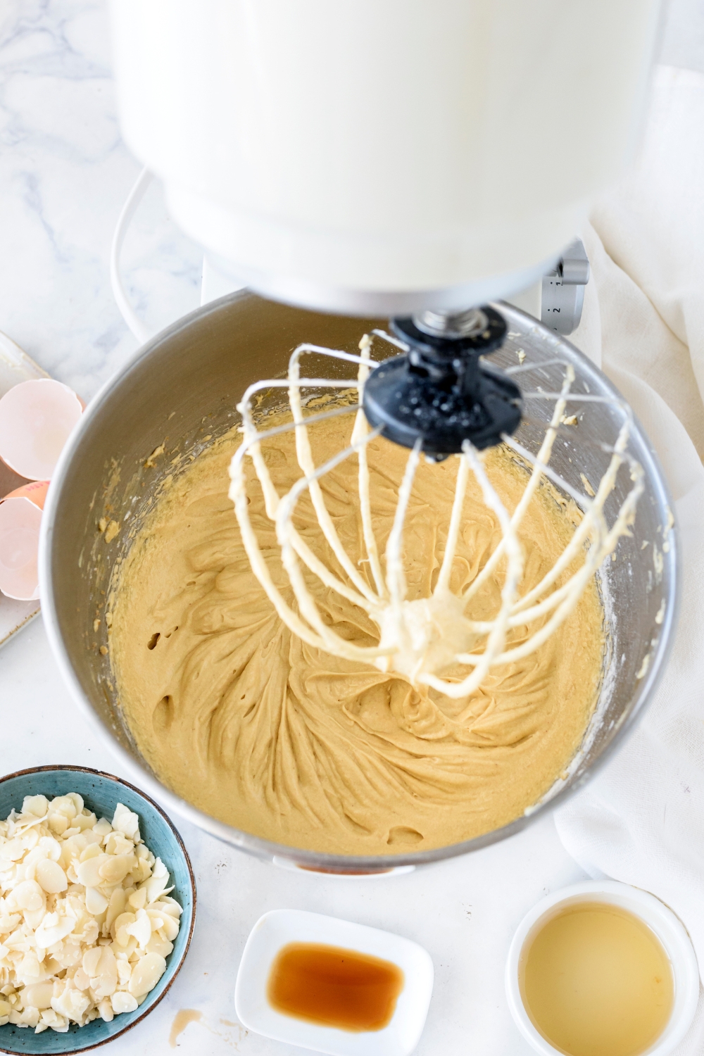 Honey cake batter being mixed in a stand mixer.