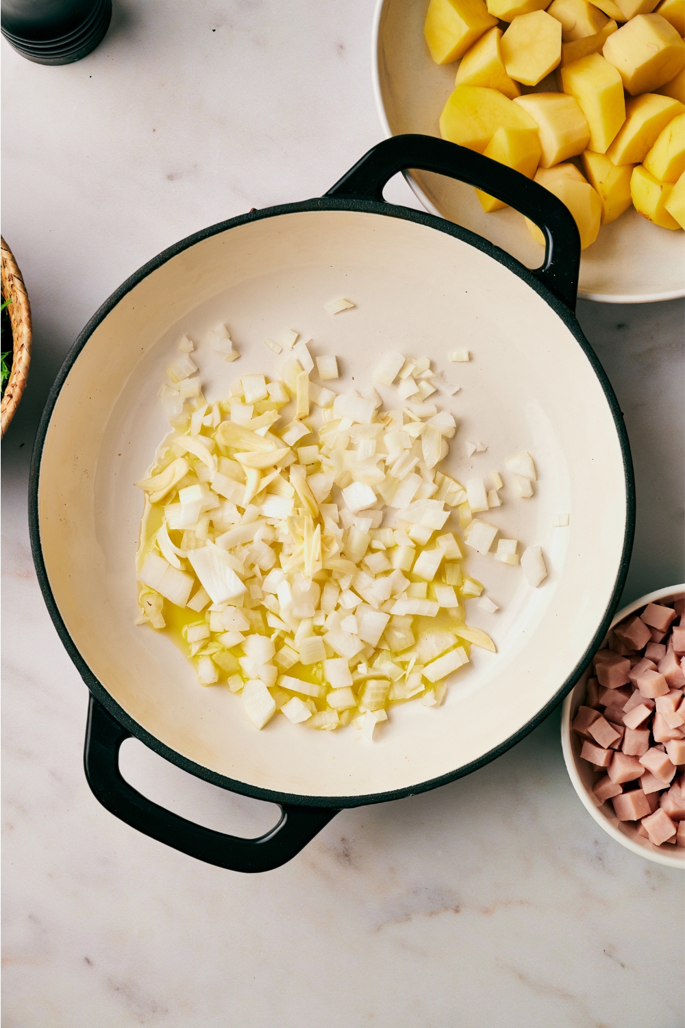 A pot with onions cooking.