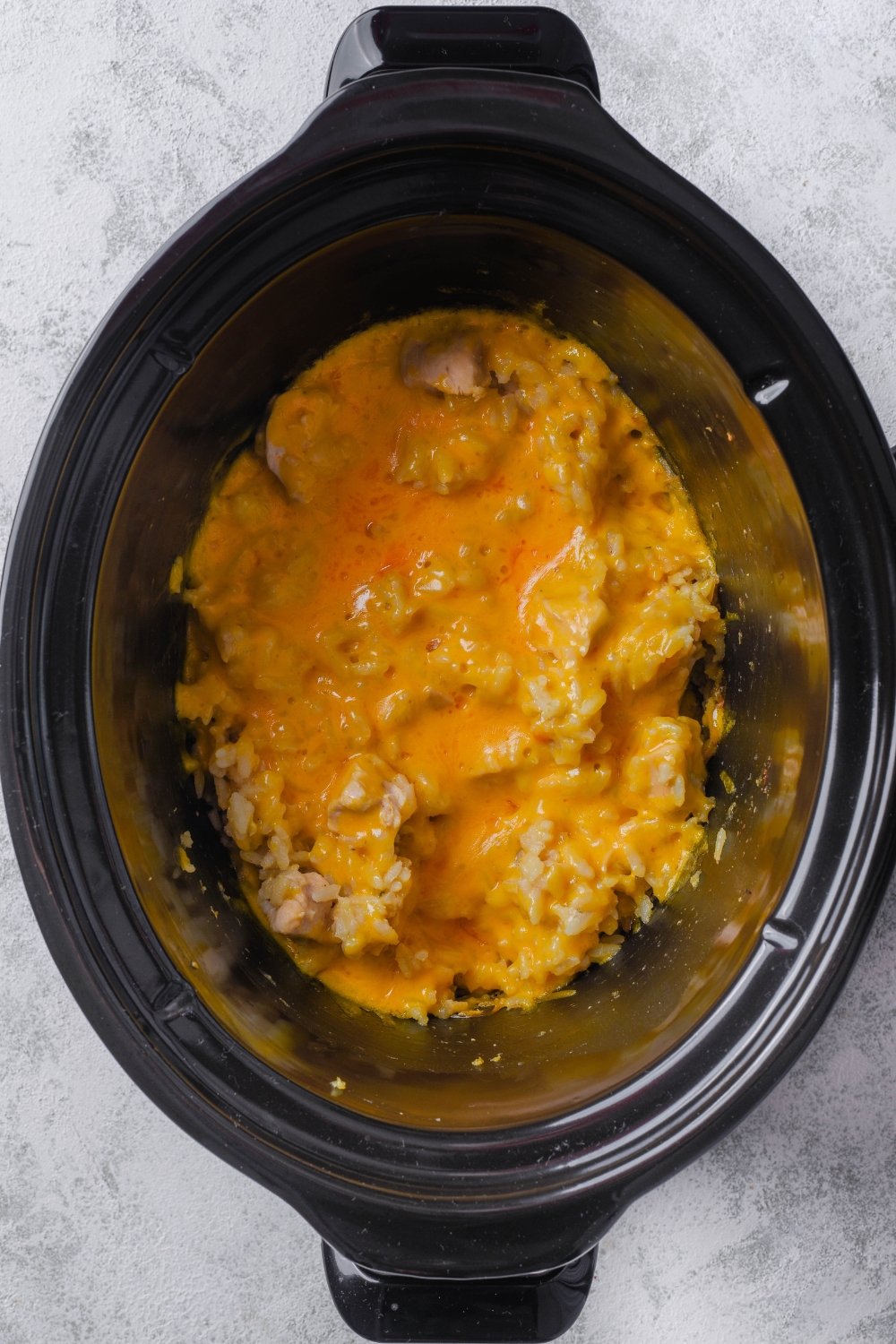 Cheesy chicken rice in a crock pot.