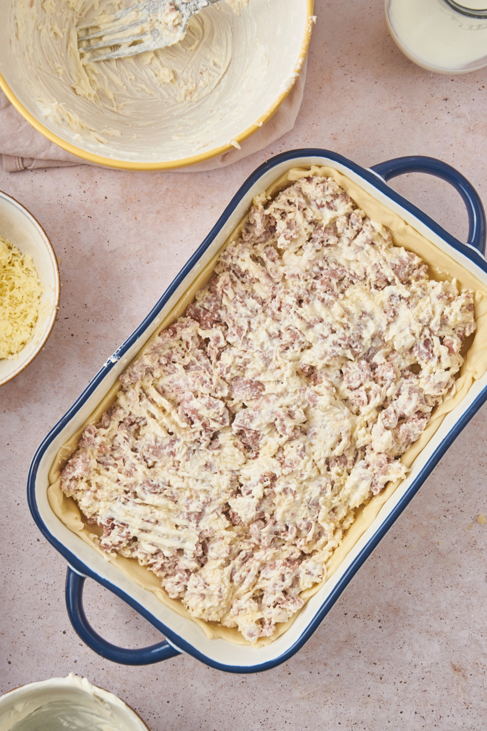 A cream cheese sausage mixture in a baking dish.
