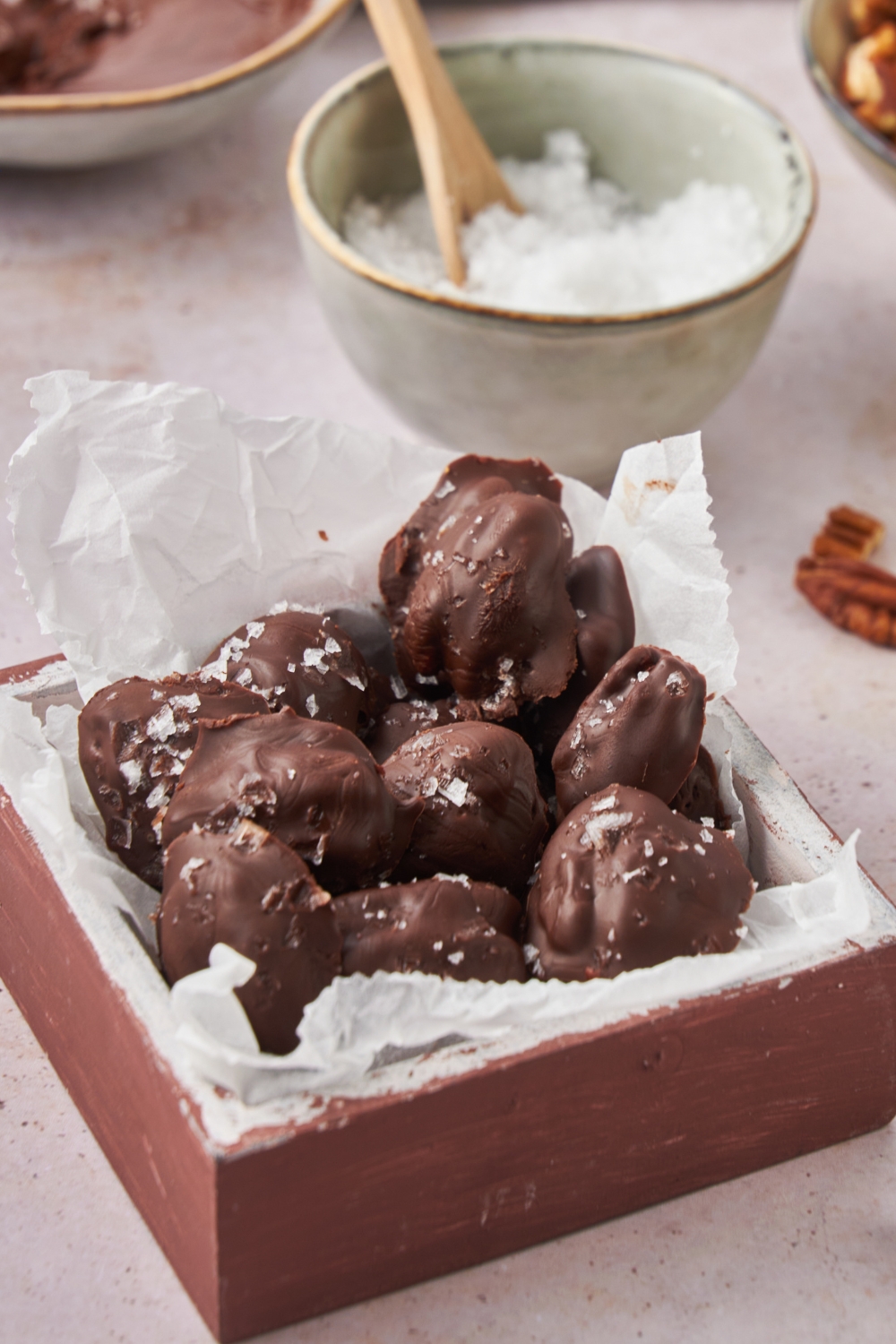 Chocolate covered pecans topped with salt.